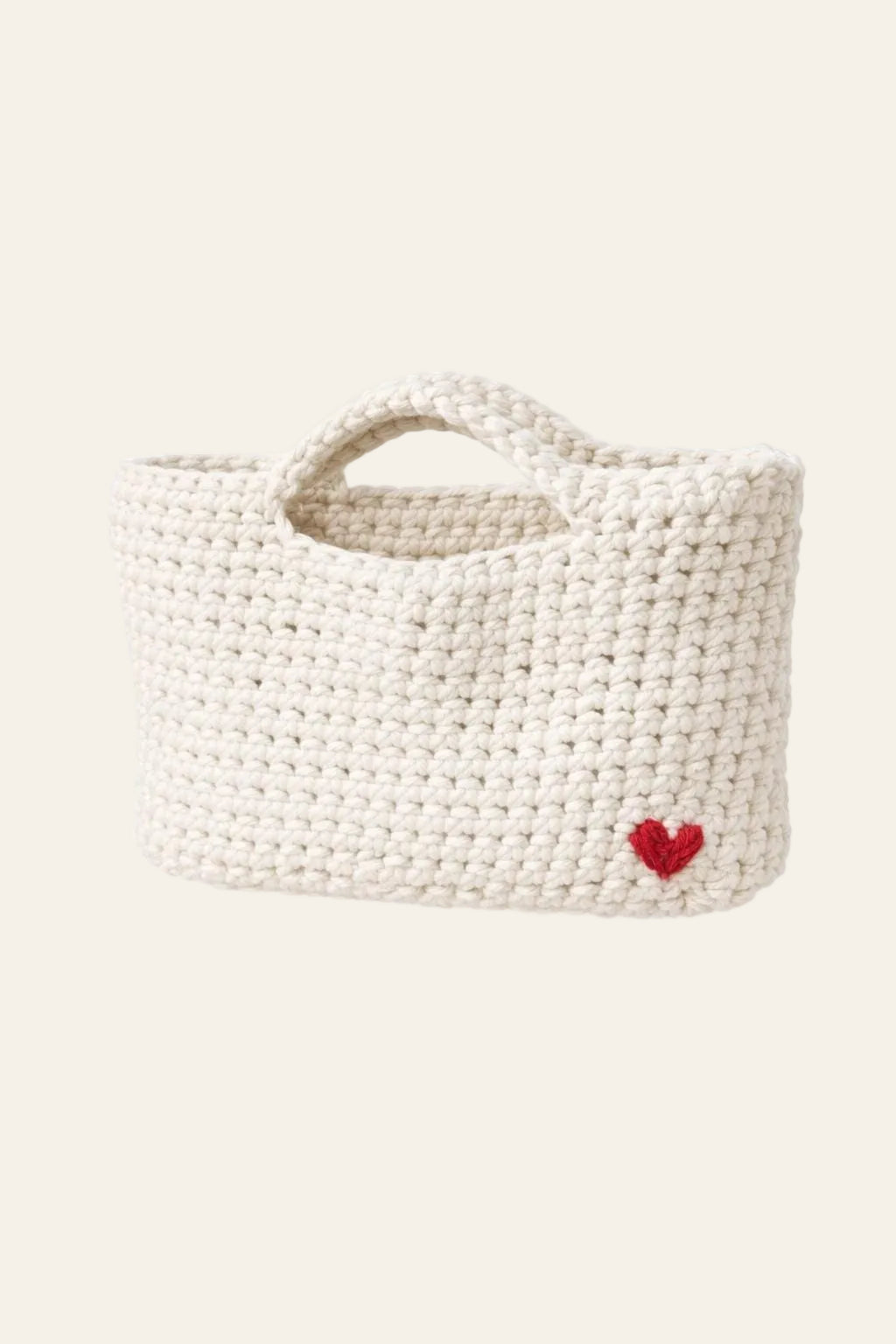 Crochet mini tote bag pattern with subtle heart detail — minimalist handmade purse in cream cotton yarn