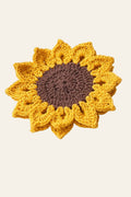 Crochet sunflower coaster pattern — handmade textured sunflower coaster in yellow and brown cotton yarn under a mug