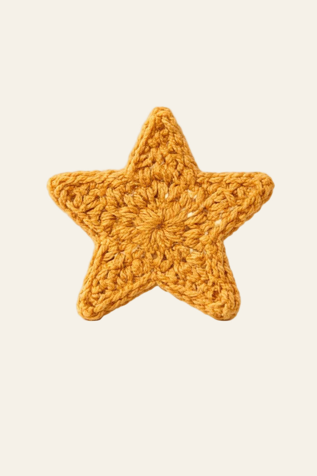 Crochet star appliqué stitched onto a tote bag showing one of many uses for the beginner-friendly star PDF