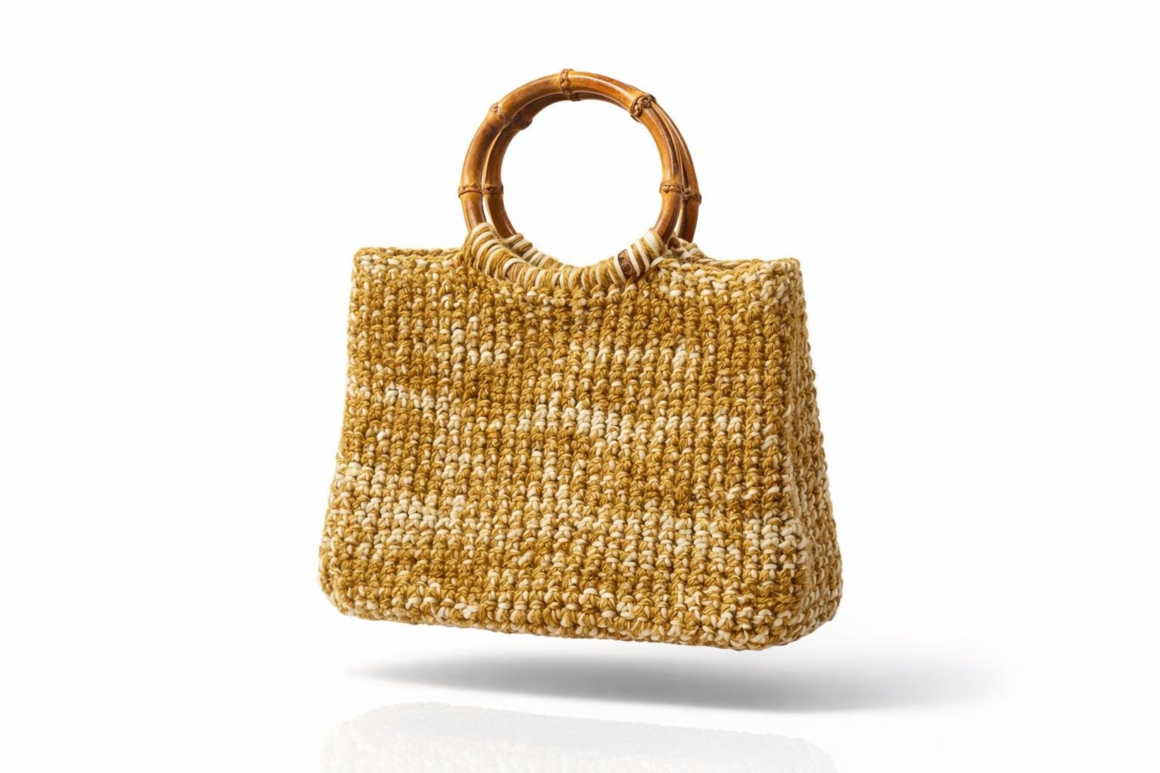 Close-up of the BLO slip stitch wall texture on the bamboo handle crochet tote, showing the dense ridged fabric