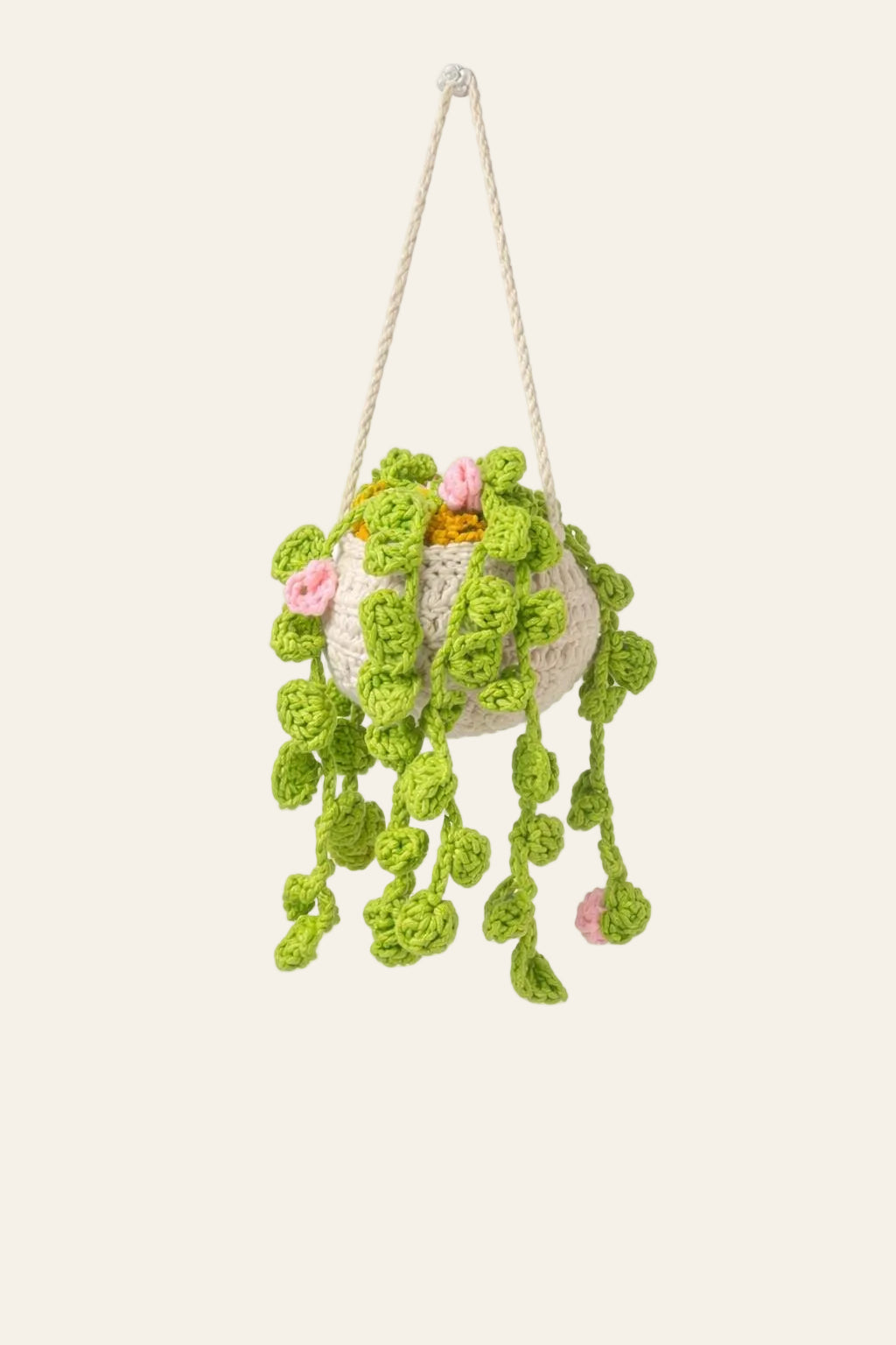 Crochet string of turtles plant pattern — handmade trailing succulent with turtle-shell leaves cascading from a planter