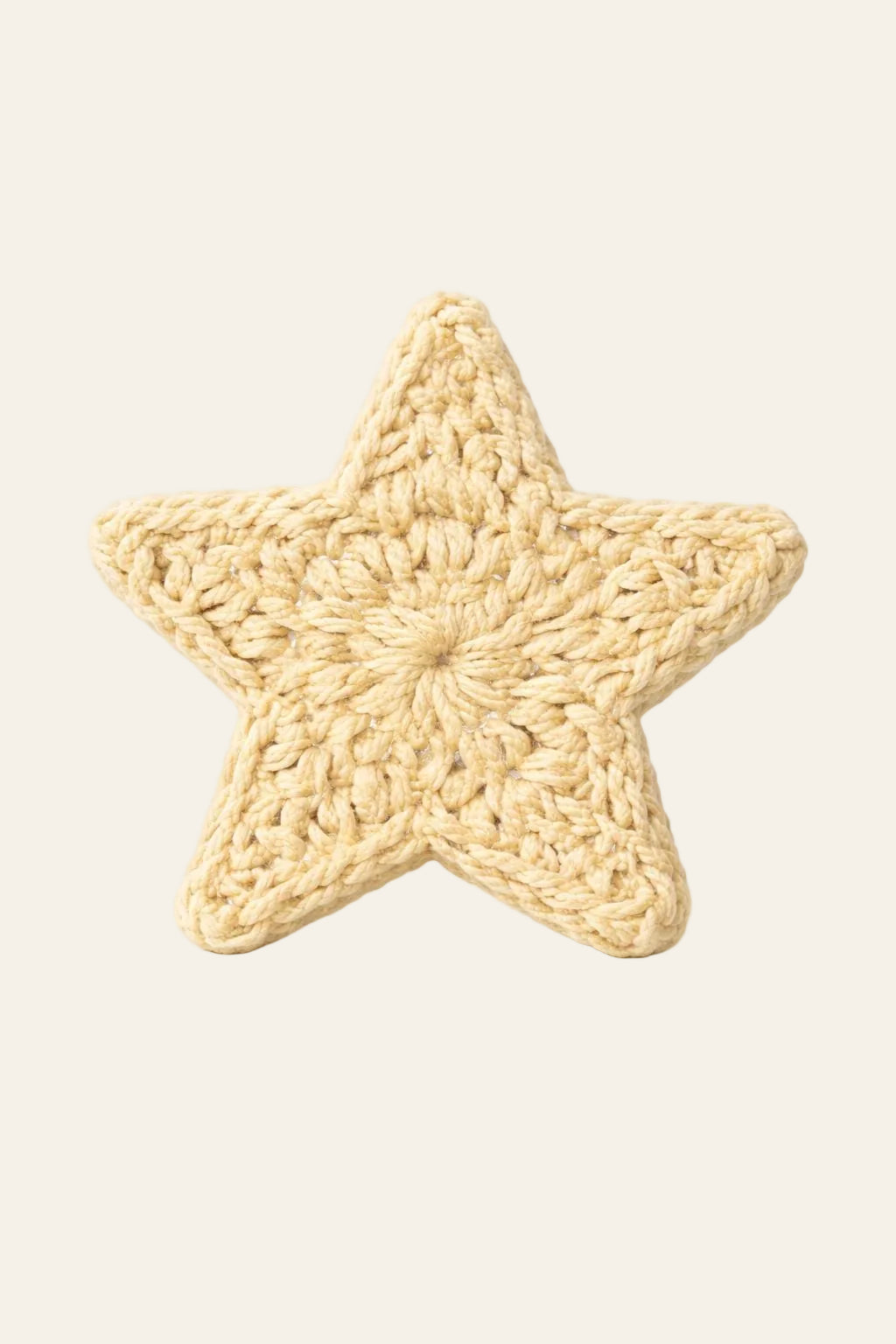 Crochet star ornaments hung on a Christmas tree branch — versatile holiday crochet decor pattern